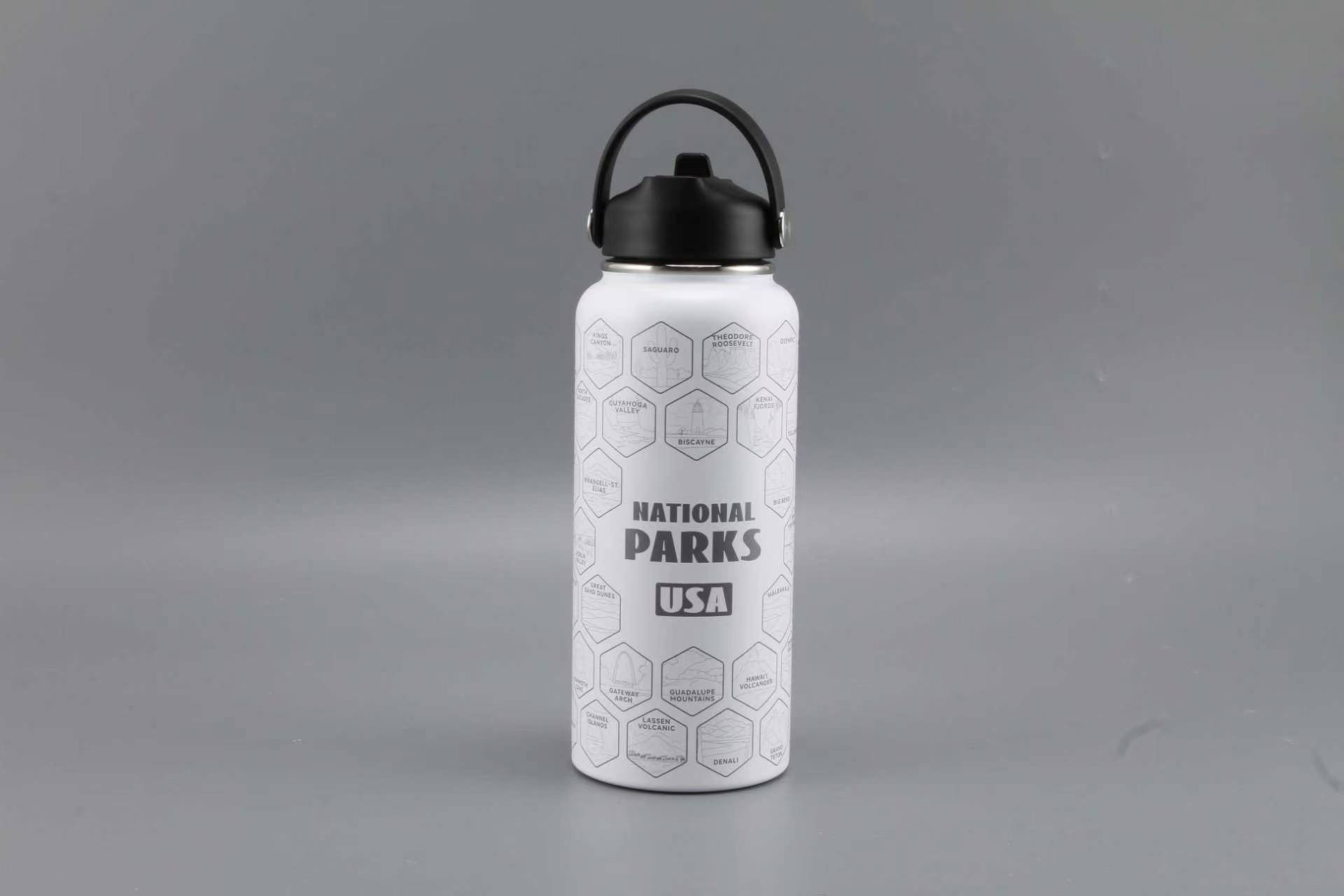 Insulated national parks water bottle displayed on an outdoor hiking trip